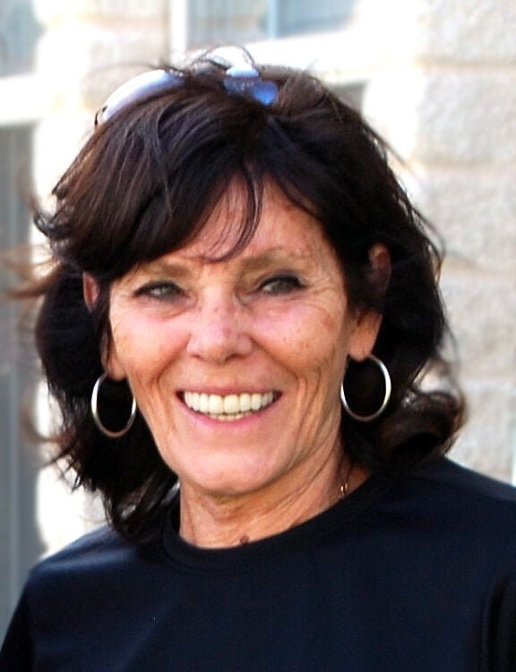 Marcia Zierlein, smiling, outdoors